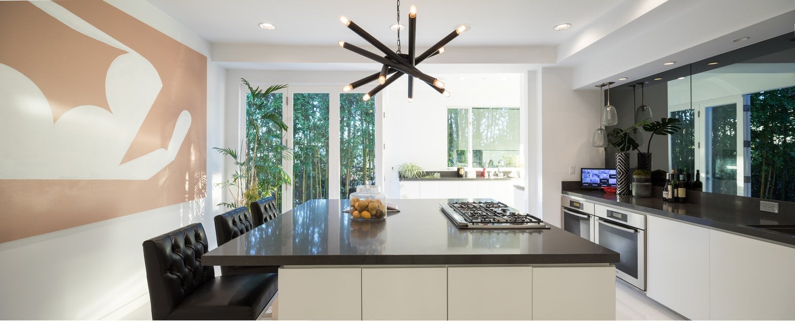 the-sleek-modern-kitchen-is-perfect-for-cooking-and-entertaining-with-a-large-island-and-designer-appliances